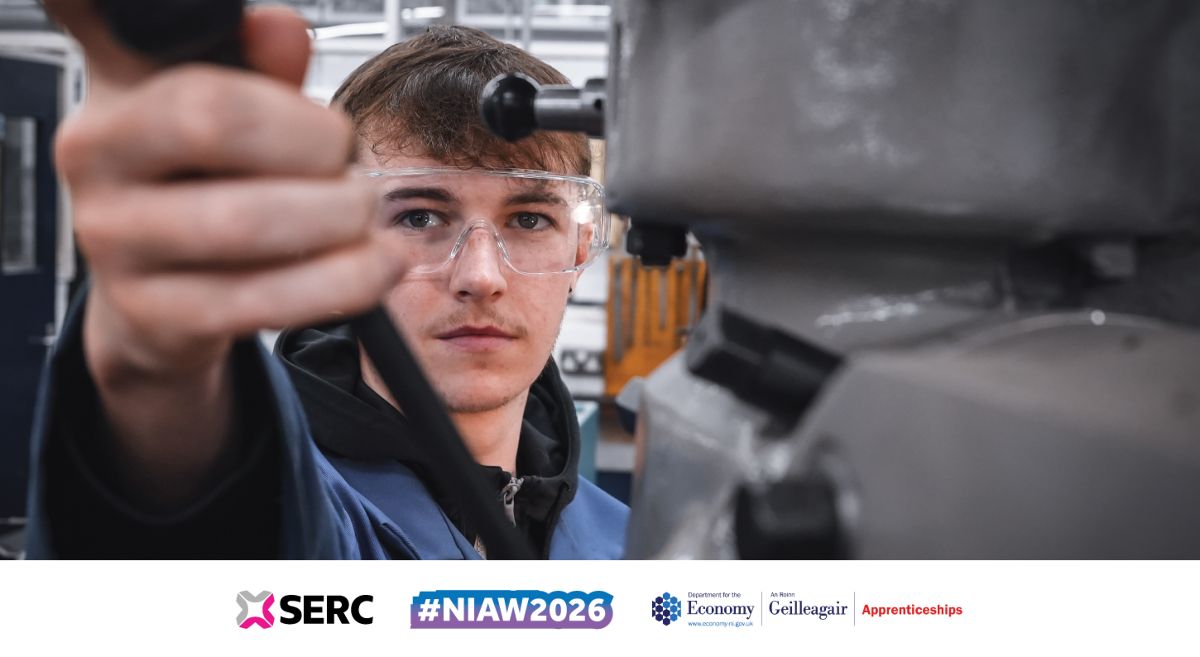 Image showing engineering student pulling handle of a machine.